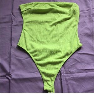 Backless neon green body suit